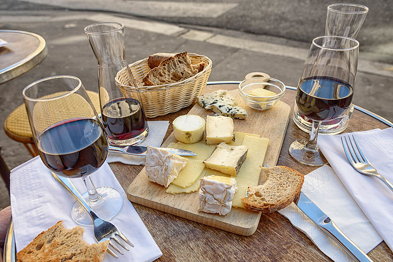 Cheese, wine and bread in a sidewalk cafe in Paris, June 2015